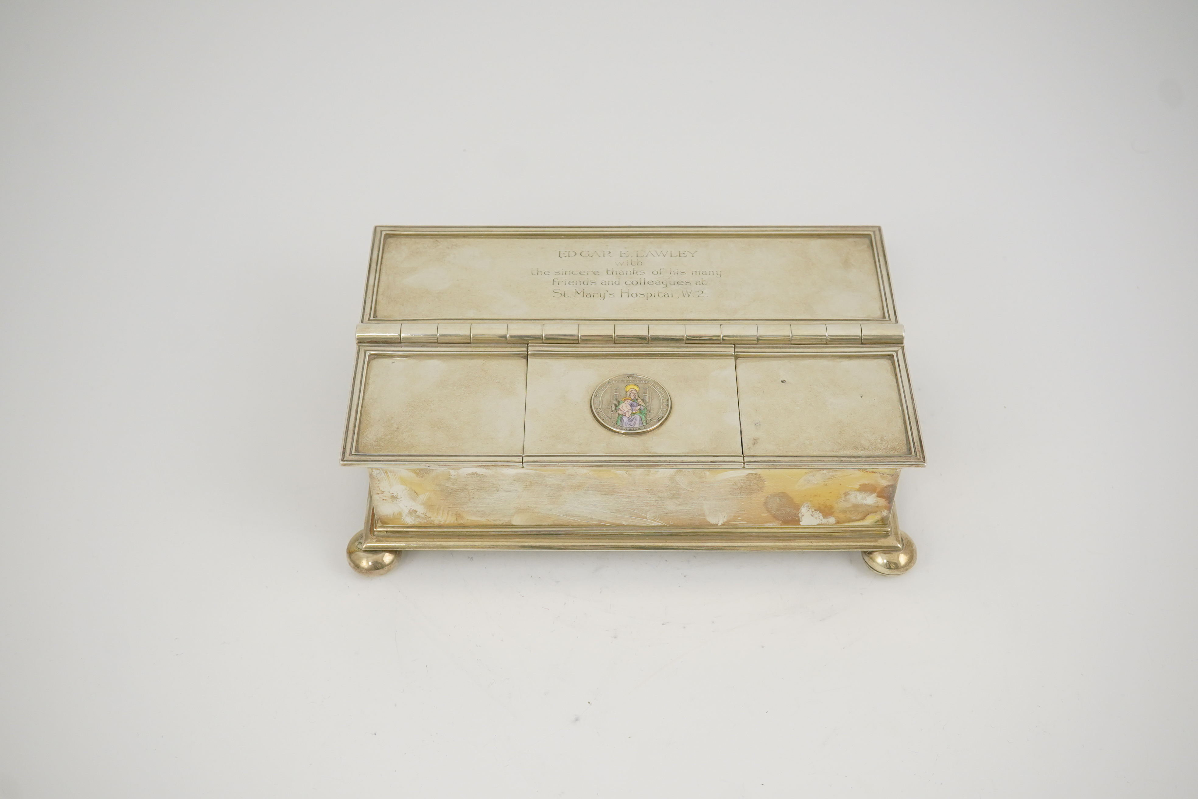 A George V Britannia standard silver and enamel combination ‘treasury inkstand/ cigarette box, by Crichton Brothers